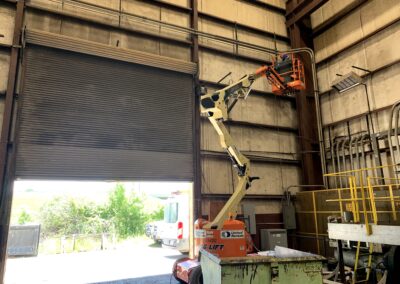 Articulating Boom Lift in Warehouse